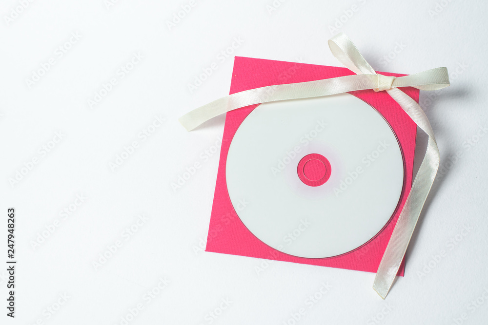 Fototapeta premium red envelope with yellow ribbon in the shape of a bow for CD, vertical position . square envelope