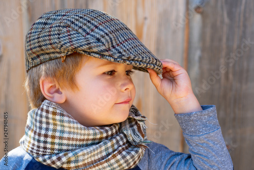 Children fashion model. Cute child. Boy in the cap. Vintage kid concept. Elegant young man. photo