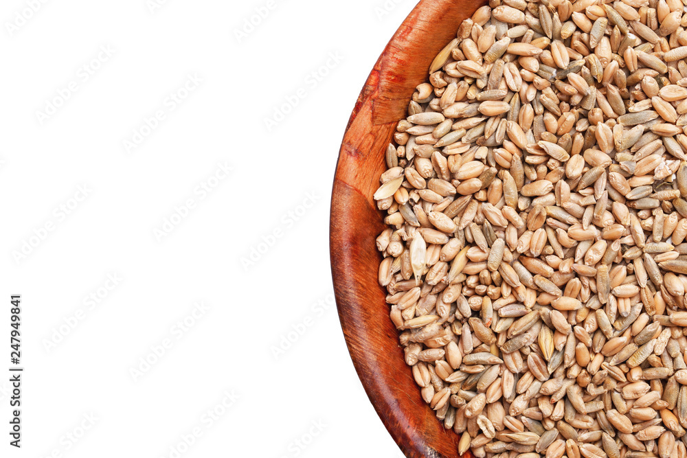 Kitchen container filled with wheat and rye. Cereal grains in wooden bowl. Healthy food field harvest background. Kitchen container filled with wheat and rye. Cereal grains in wooden bowl. Healthy food field harvest background.