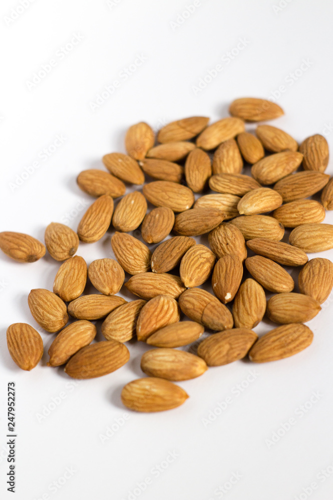 handful of almonds on white background handful of almonds on white background