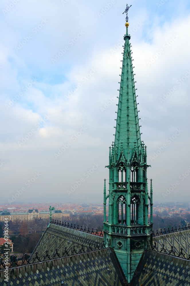 Tower of Gothic St. Vitus Cathedral on background of city, Prague, Czech Republic Tower of Gothic St. Vitus Cathedral on background of city, Prague, Czech Republic