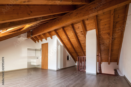 Bright attic with wooden beams and parquet