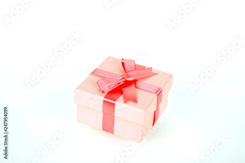 gift box with red bow and white background © luisrojasstock