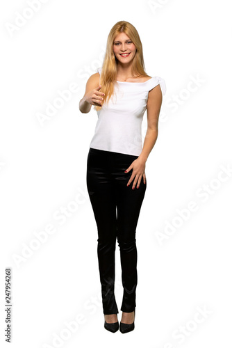 Young blonde woman shaking hands for closing a good deal over isolated white background