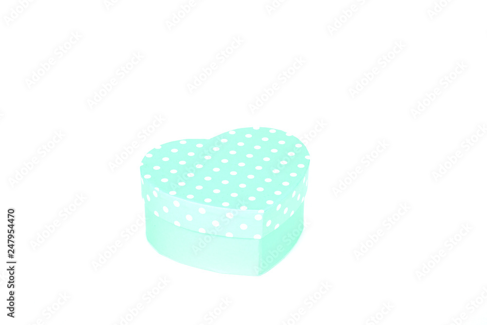 green gift box with white polka dots and heart shape on white background green gift box with white polka dots and heart shape on white background