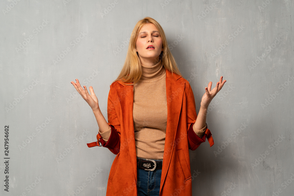 Woman over textured background frustrated by a bad situation Woman over textured background frustrated by a bad situation