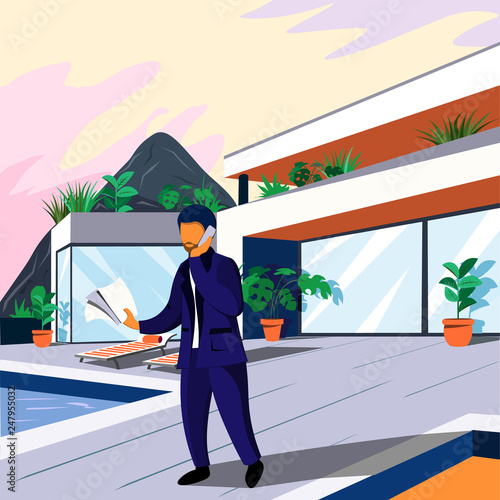 Modern comfortable house with a terrace for rest and a man in a suit talking on the phone. View from the outside. Architecture and design.