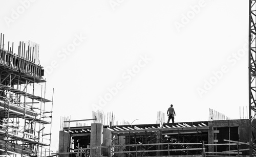 Scaffolding at the construction site of a new building. Tel-Aviv, Israel. Construction site background. Black  white historic photo.