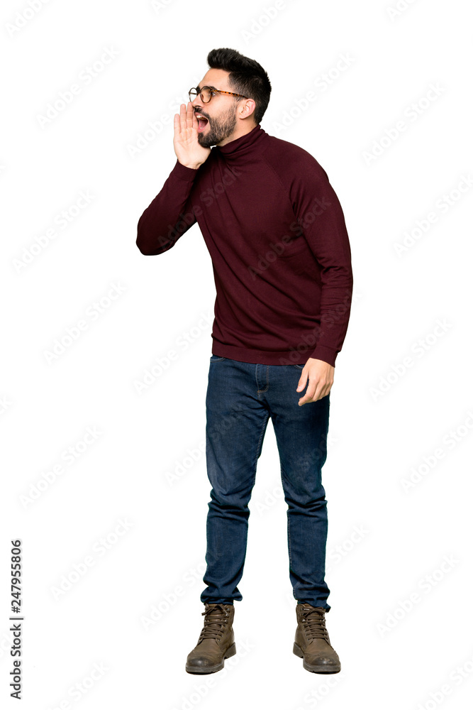 Full-length shot of Handsome man with glasses shouting with mouth wide open to the lateral on isolated white background Full-length shot of Handsome man with glasses shouting with mouth wide open to the lateral on isolated white background