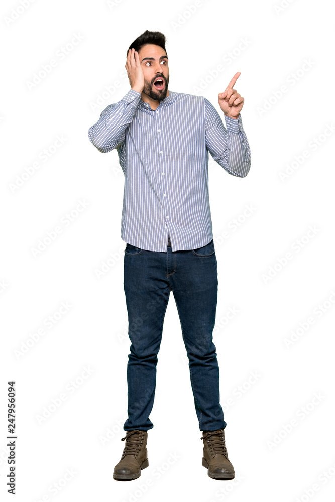 Full-length shot of Elegant man with shirt pointing up and surprised on isolated white background Full-length shot of Elegant man with shirt pointing up and surprised on isolated white background