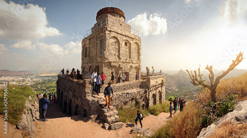 Gingee Fort or Senji Fort, Tamil Nadu, India, December 4, 2018: View of the valley with a fortress on top of the mountain photo