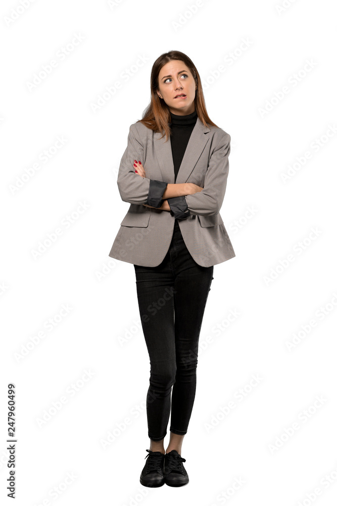 A full-length shot of a Business woman with confuse face expression while bites lip over isolated white background A full-length shot of a Business woman with confuse face expression while bites lip over isolated white background