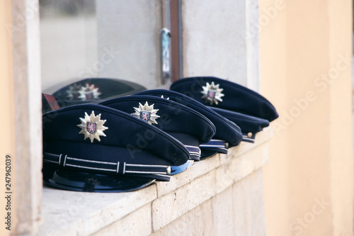 german police hat in a row