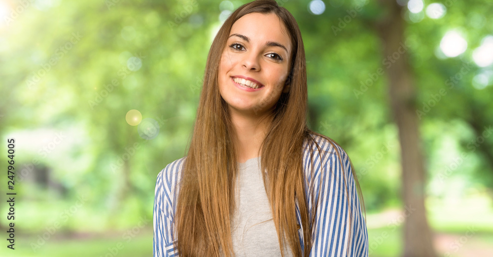 Young girl with striped shirt With happy expression at outdoors Young girl with striped shirt With happy expression at outdoors