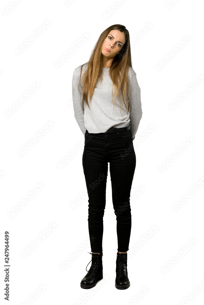Full-length shot of young girl with sad and depressed expression on isolated white background Full-length shot of young girl with sad and depressed expression on isolated white background