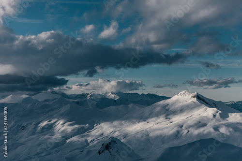 Epic mountains with some clouds in the evening sun at Davos Switzerland 