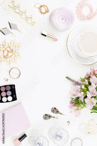 Feminine flat lay with women fashion accessories, lingerie, jewelry, cosmetics, coffee and flowers. Top view