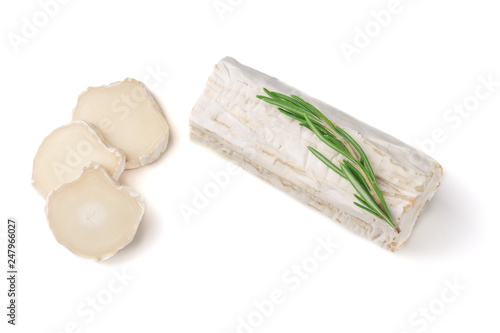 Stick of a goat cheese on paper on  the white background.