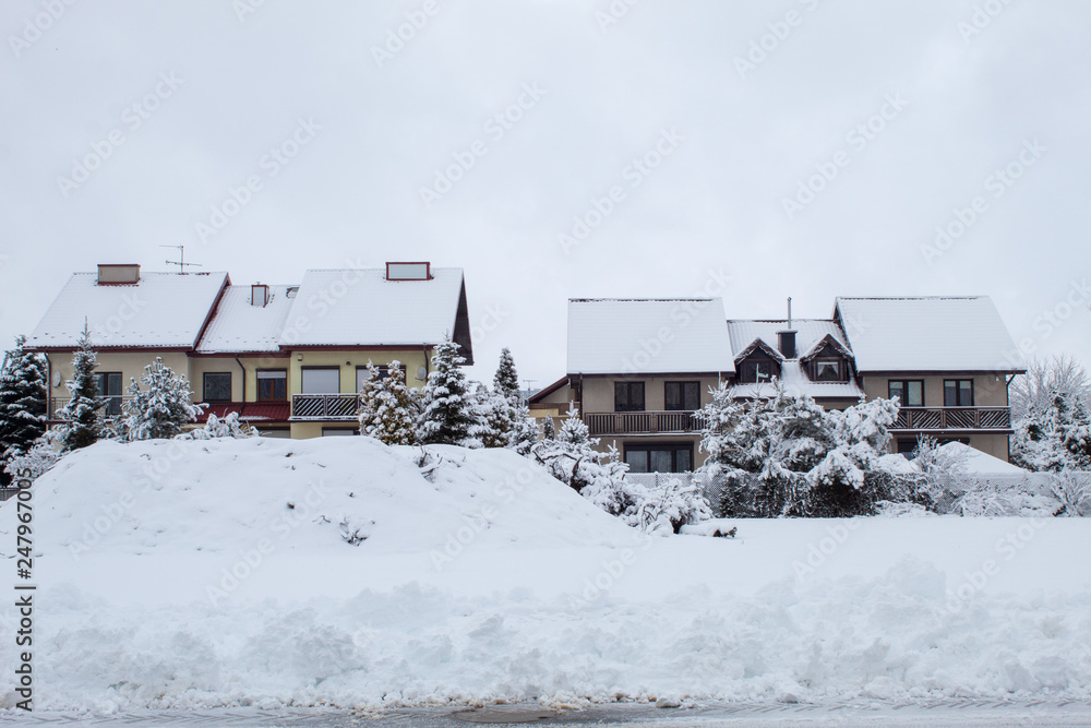 Fabulously beautiful snow-covered houses, streets and roads in the snow, winter snowfall, snow drifts Fabulously beautiful snow-covered houses, streets and roads in the snow, winter snowfall, snow drifts