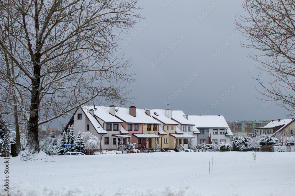 Fabulously beautiful snow-covered houses, streets and roads in the snow, winter snowfall, snow drifts
