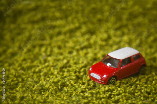 car on a green grassy background