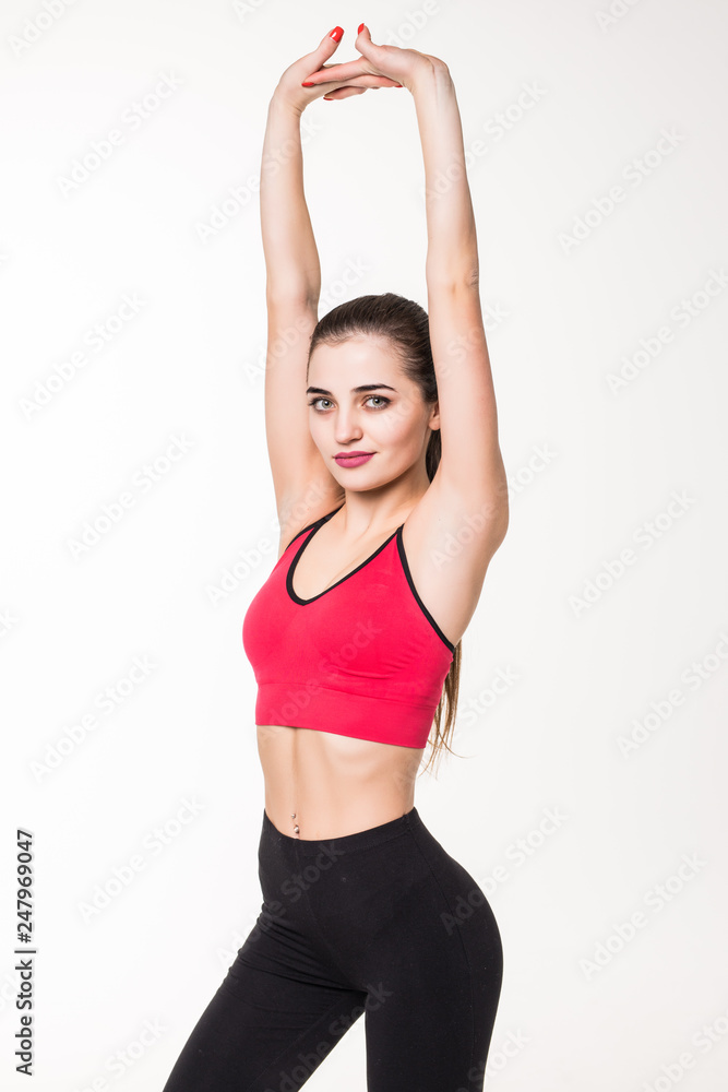 Studio shot of a young woman stretching before exercising. Sporty young woman warming up on white background. Studio shot of a young woman stretching before exercising. Sporty young woman warming up on white background.