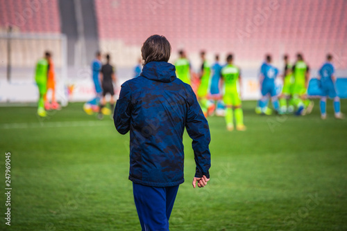Football head trainer during professional soccer match photo