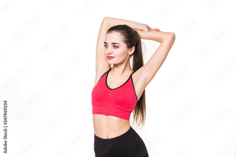 Portrait of a happy fitness woman stretching hands isolated on a white background Portrait of a happy fitness woman stretching hands isolated on a white background
