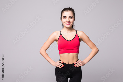 Portrait of smiling fitness young woman isolated on white background