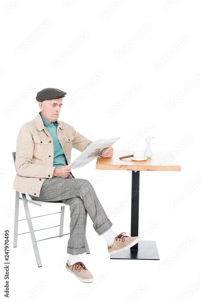 custom made wallpaper toronto digitalretired man reading newspaper while sitting on chair with crossed legs isolated on white