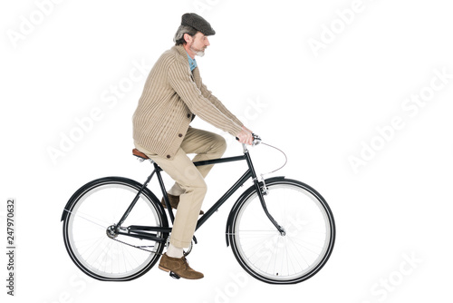 cheerful pensioner riding bicycle isolated on white