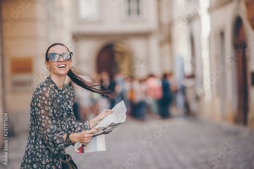 Photography Young woman with a city map in city
