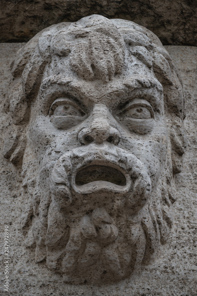 Sculpture of mysterious ancient creature in downtown of Potsdam, Germany, portrait, details