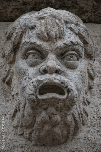 Sculpture of mysterious ancient creature in downtown of Potsdam, Germany, portrait, details