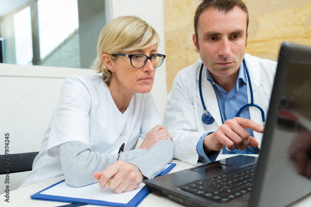 doctors working with laptop computer doctors working with laptop computer
