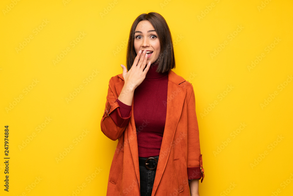 Young woman with coat with shocked facial expression Young woman with coat with shocked facial expression