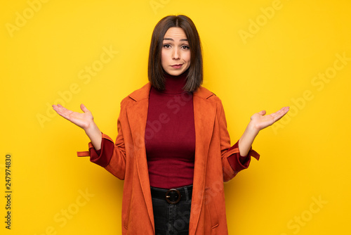 Young woman with coat unhappy because not understand something
