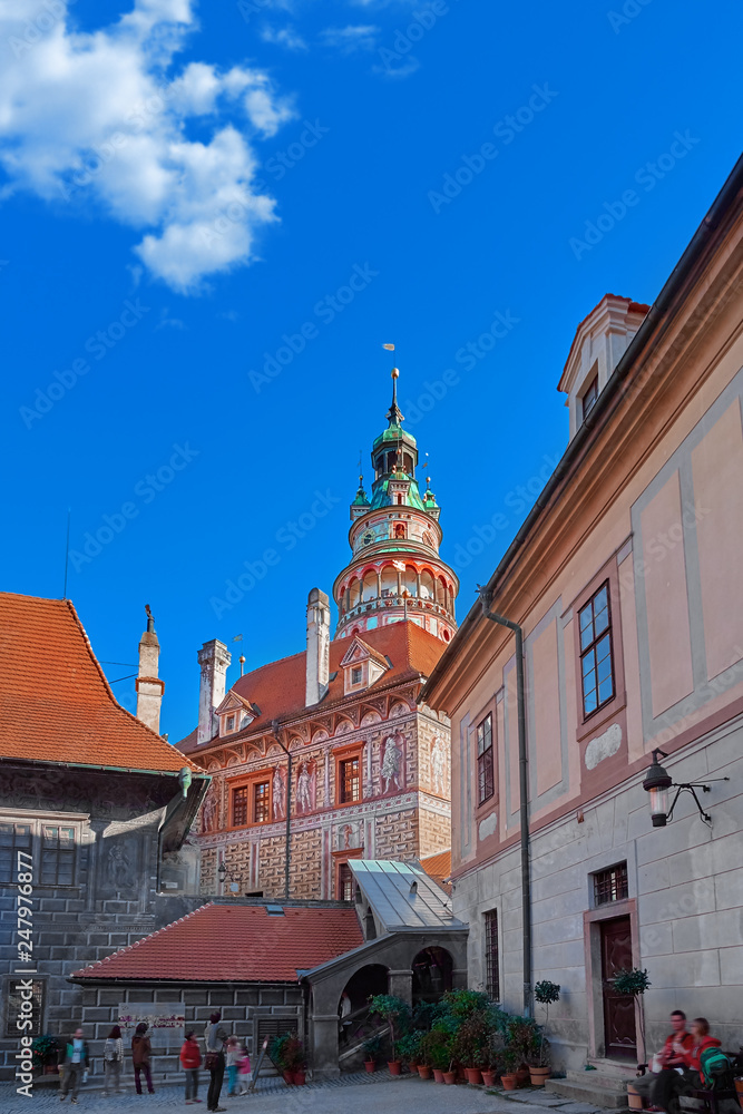 Fototapeta premium Beautiful sunset over historic centre of Chesky Krumlov old town in the South Bohemian Region of the Czech Republic on Vltava River. UNESCO World Heritage Site