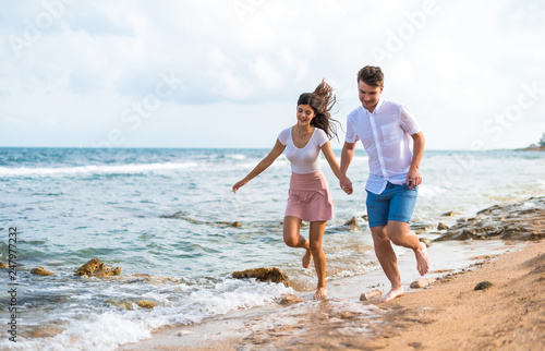 Young couple at outdoors running fast