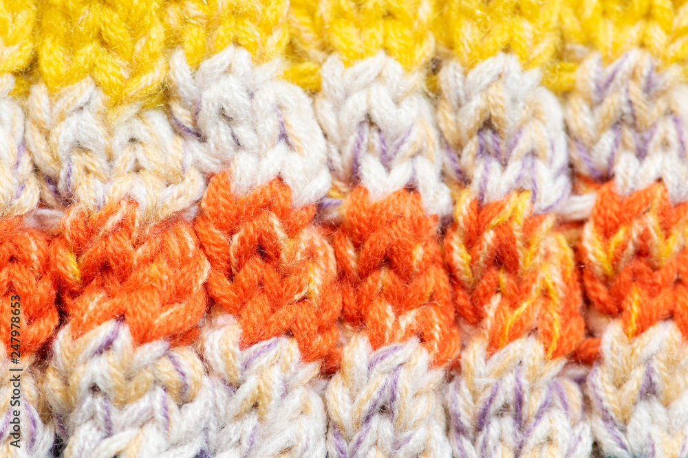 Background of the wool yarn. Woolen fabric texture closeup. Textile texture background. Detailed warm yarn background.