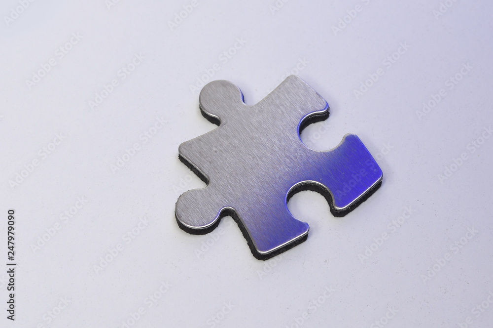 Obraz premium metal puzzle on a white background