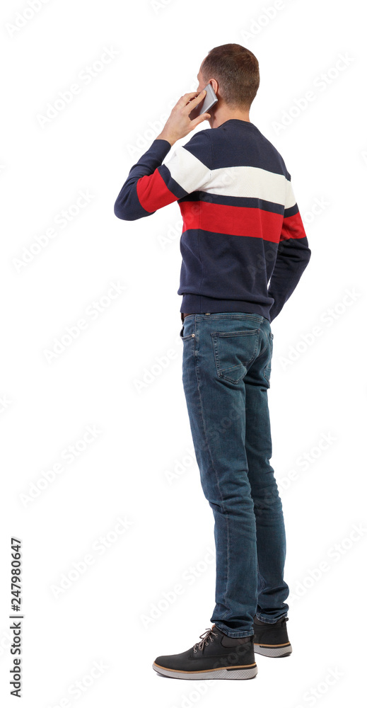back view of business man talking on mobile phone. back view of business man talking on mobile phone.