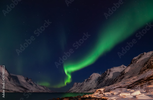 Amazing Aurora Borealis in North Norway (Kvaloya), mountains in the background © Kamila Sankiewicz