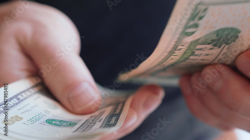Businessman hands counting many american 20 dollars banknotes 4K close up slow mo