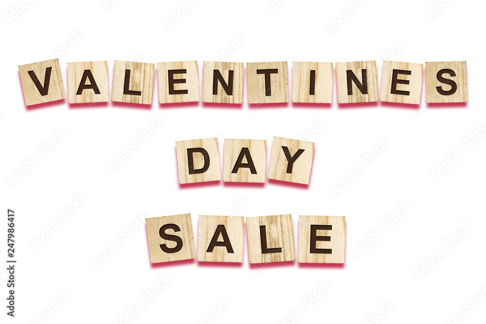 Sale for Valentine's Day, the inscription, composed of alfovita on wooden cubes. White background. Isolated. Holiday sales. Sale for Valentine's Day, the inscription, composed of alfovita on wooden cubes. White background. Isolated. Holiday sales.