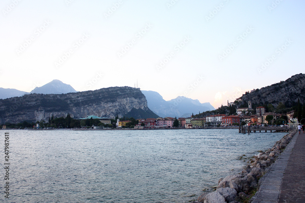 Evening walk. Picturesque lake Garda