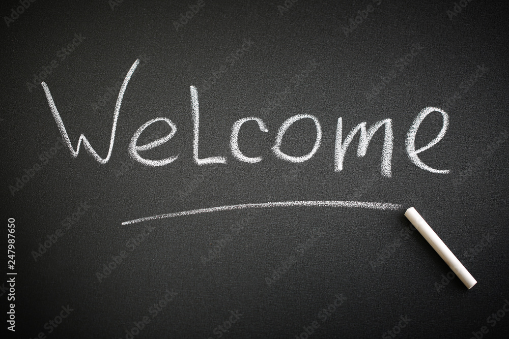 Fototapeta premium Welcome word on a blackboard. Greeting concept