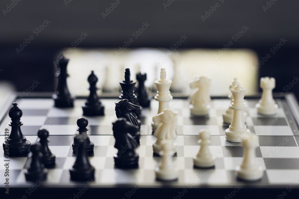 chessboard with a chess piece on the back Negotiating in business. as background business concept and strategy concept with copy space. chessboard with a chess piece on the back Negotiating in business. as background business concept and strategy concept with copy space.