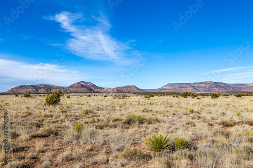 A remote New Mexico landscape, with a blue sky overhead