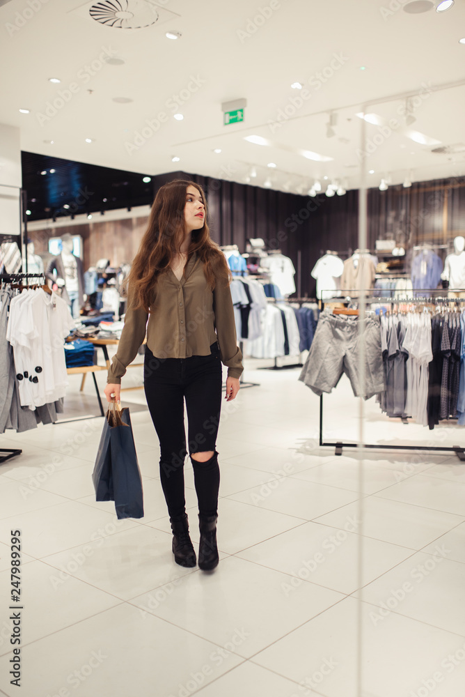 Woman in shopping. Happy woman with shopping bags enjoying in shopping. Consumerism, shopping, lifestyle concept